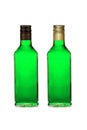 Two bottles with green liquor wih black and golden caps isolated on white Royalty Free Stock Photo