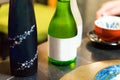 Two bottles of japanese wine on the table, Tokyo, Japan. Close-up. Royalty Free Stock Photo