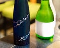 Two bottles of japanese wine on the table, Tokyo, Japan. Close-up. Royalty Free Stock Photo