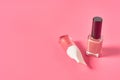 Two bottles of luxury nail polish on pink background Royalty Free Stock Photo