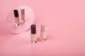 Two bottles of luxury nail polish on pink background. Beauty and fashion concept Royalty Free Stock Photo