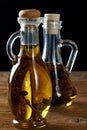 Two bottles of olive oil on table Royalty Free Stock Photo