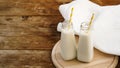 Two bottles of organic rustic milk on wooden table Royalty Free Stock Photo