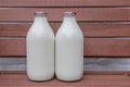 Two Milk Bottles on a Doorstep Royalty Free Stock Photo