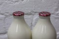 Two Milk Bottles on a Doorstep Royalty Free Stock Photo