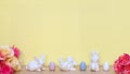 Two bouquets of roses and three white rabbits with three easter eggs Royalty Free Stock Photo
