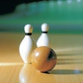 Two bowling pins and a ball on the lane. Bowling game.