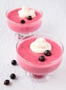 Two bowls of black currant mousse