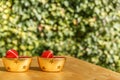 Two bowls with Christmas balls on a wooden table Royalty Free Stock Photo