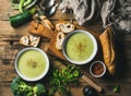 Two bowls of homemade pea, broccoli and zucchini cream soup Royalty Free Stock Photo