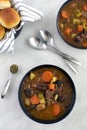 Bowls of Italian Beef Stew with Dinner Rolls