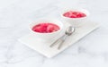 Two Bowls on Marble Board filled with Rhubarb Compote Royalty Free Stock Photo