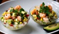 Two bowls of shrimp salad with avocado and corn