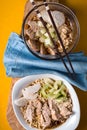 Two bowls of soup noodle ramen, celery, chicken and blue napkin Royalty Free Stock Photo