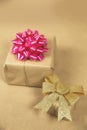 Two boxes in eco brown plain paper witg gold and pink wrapping decoration, present for Birthday, Valentine`s day mother Royalty Free Stock Photo