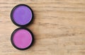 Two Boxes Of Eyeshadows Pink And Violet On Wood Table Royalty Free Stock Photo