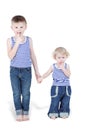 Two boy brothers in striped singlets stand Royalty Free Stock Photo