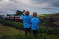 Two boy, looking at old steam train Royalty Free Stock Photo