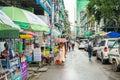 Two boy novice monks, pair of children monks, wearing pink robes, collecting daily alms in Yangon