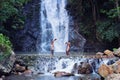 Two boy play and laugh fishing at a waterfall countryside thailand.Fishing boy asian by gaff in creek with beautiful background