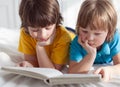 Two boy read book indoors Royalty Free Stock Photo