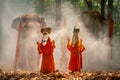 Two boy wear Pee Ta Khon, traditional culture art as ghost of Asian culture, dress and action to show horror position and