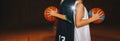 Two Boys Basketball Team Players Holding Basketballs on the Wooden Court. Basketball Training For Kids Royalty Free Stock Photo