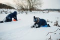 Two boys brothers playing in winter nature. Outdoors in snow Royalty Free Stock Photo