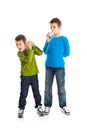 Two boys calling tin can phone. Royalty Free Stock Photo