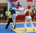 Two boys contest in a Taekwondo competiton Royalty Free Stock Photo