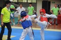 Two boys contest in a Taekwondo competiton