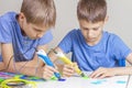 Two boys creating with 3d printing pens Royalty Free Stock Photo