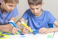 Two boys creating with 3d printing pens Royalty Free Stock Photo