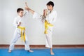 Two boys demonstrate martial arts working together Royalty Free Stock Photo