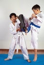 Two boys demonstrate martial arts working together Royalty Free Stock Photo