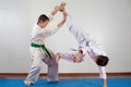 Two boys demonstrate martial arts working together Royalty Free Stock Photo