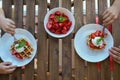 Two boys eat for Breakfast Viennese waffles with ice cream and strawberries. Top view. Royalty Free Stock Photo