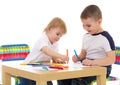 Two boys enthusiastically paint markers