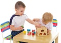 Two boys enthusiastically paint markers