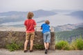 Two boys friend enjoys the view of Kotor. Montenegro. Bay of Kotor, Gulf of Kotor, Boka Kotorska and walled old city