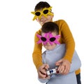 Two boys, friends or brothers, in funny glasses, with a remote control in their hands, emotionally control a toy Royalty Free Stock Photo