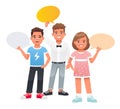 Two boys and a girl are holding empty speech bubbles in their hands. The concept of children\'s opinion. Royalty Free Stock Photo