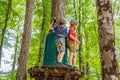 Two boys in a helmet, healthy teenager school boy enjoying activity in a climbing adventure park on a summer day Royalty Free Stock Photo