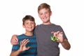 Two boys holding fidget spinners Royalty Free Stock Photo