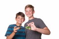 Two boys holding fidget spinners