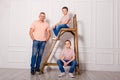 Two boys in jeans and a man. happy father and two sons Royalty Free Stock Photo