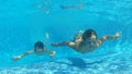 Two Boys Jumping Into Pool Then Swims Underwater To Camera
