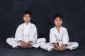 Two boys of the karate in a white kimono