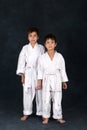 Two boys of the karate in a white kimono
