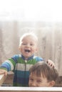 Two boys laughing a lot playing together Royalty Free Stock Photo